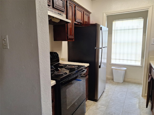 kitchen featuring electric range