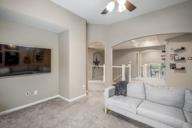 living room with carpet flooring and ceiling fan