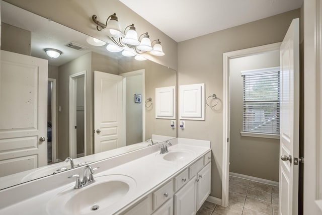 bathroom with vanity and tile patterned floors