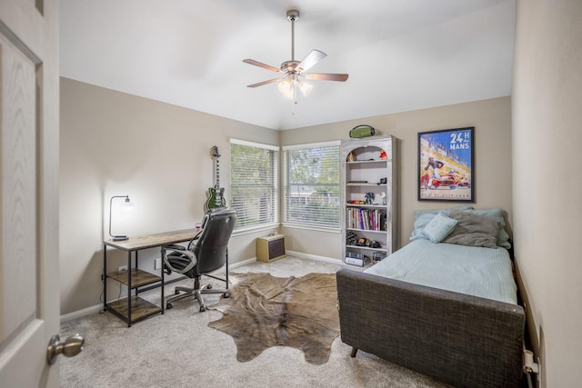 carpeted office space with ceiling fan