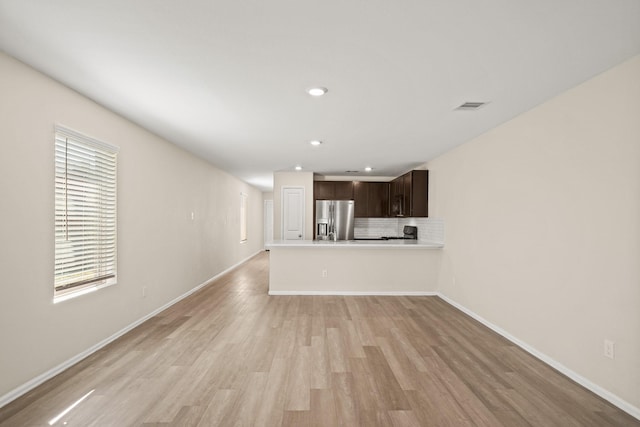 unfurnished living room with light hardwood / wood-style floors