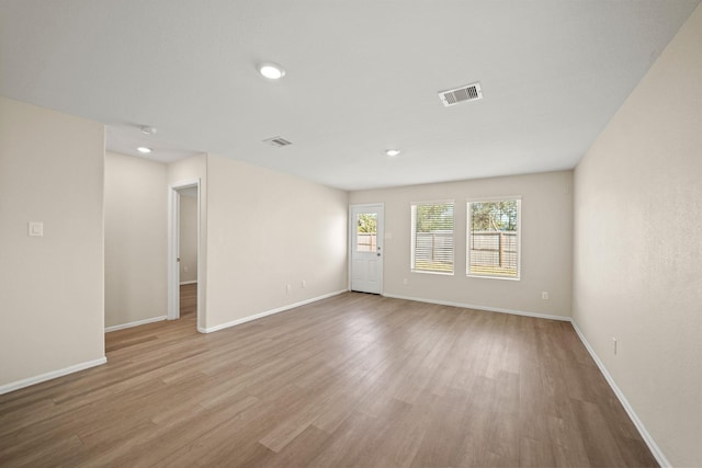 spare room featuring light hardwood / wood-style flooring