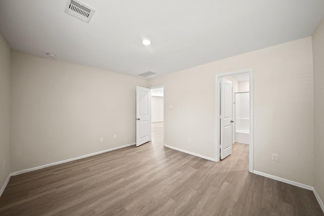 unfurnished bedroom featuring light wood-type flooring