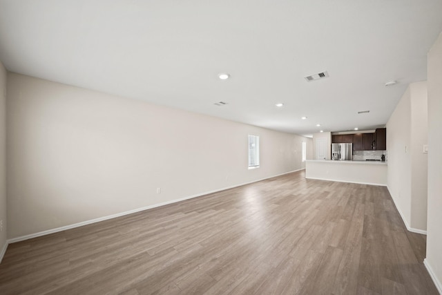 unfurnished living room featuring light hardwood / wood-style flooring