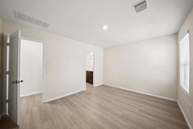 spare room with light wood-type flooring