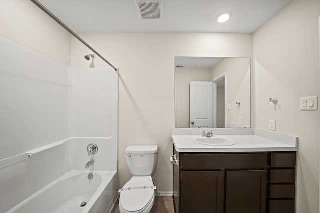 full bathroom featuring shower / tub combination, vanity, and toilet