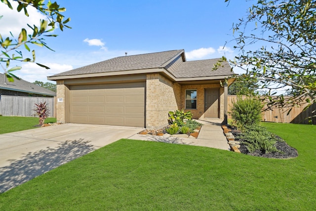 view of front of home with a garage and a front lawn