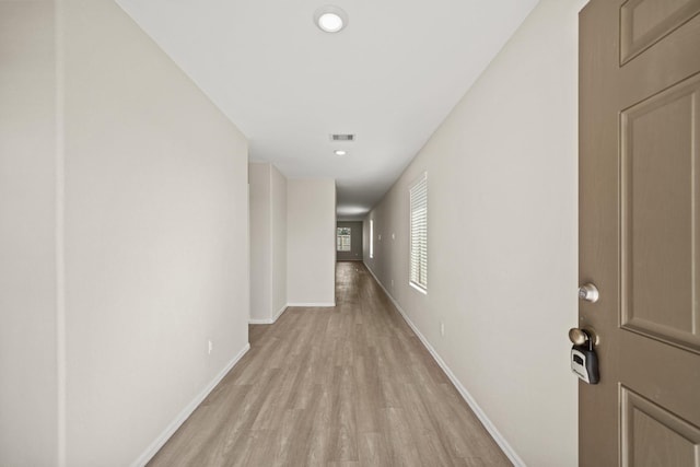 corridor featuring light hardwood / wood-style floors