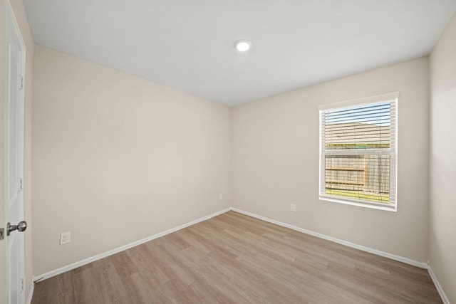 unfurnished room with light hardwood / wood-style floors