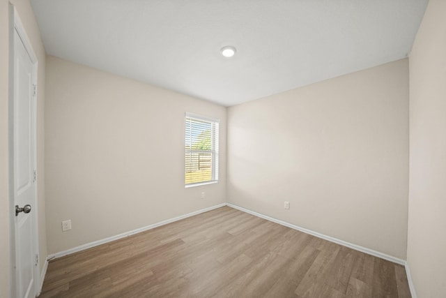 spare room featuring light hardwood / wood-style flooring