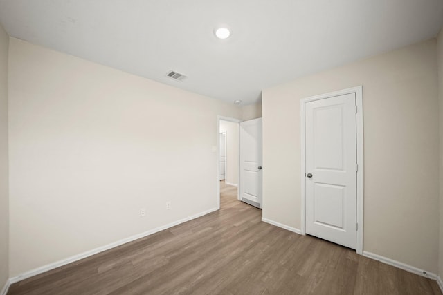 unfurnished bedroom with light hardwood / wood-style flooring