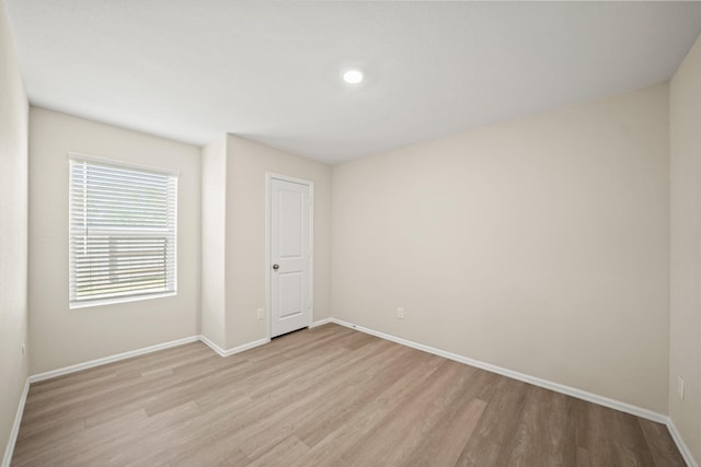 unfurnished room featuring light hardwood / wood-style floors