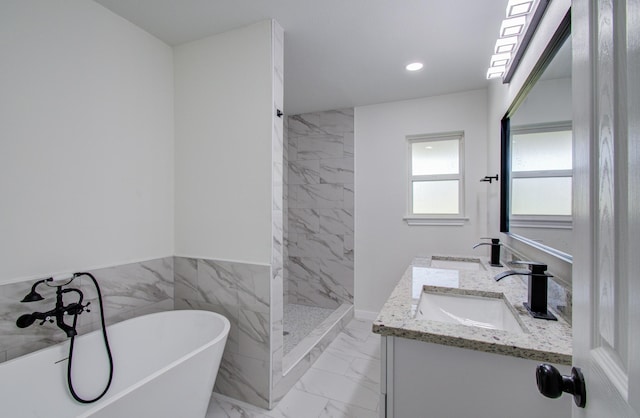 bathroom featuring vanity and shower with separate bathtub