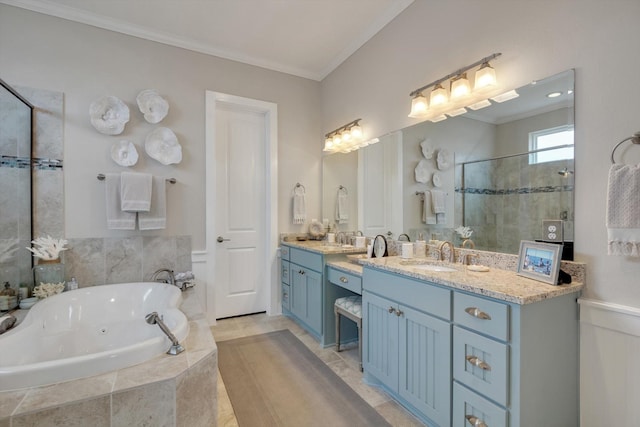 bathroom with vanity, ornamental molding, and separate shower and tub