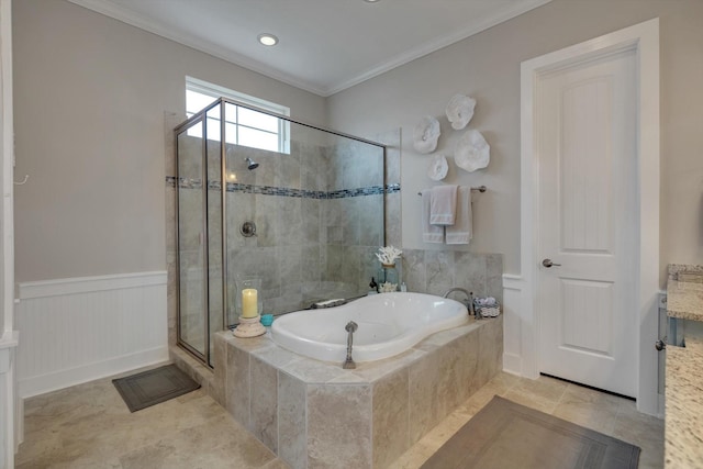 bathroom with tile patterned floors, ornamental molding, and shower with separate bathtub