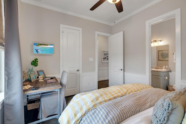 bedroom featuring sink, ensuite bath, ornamental molding, and ceiling fan