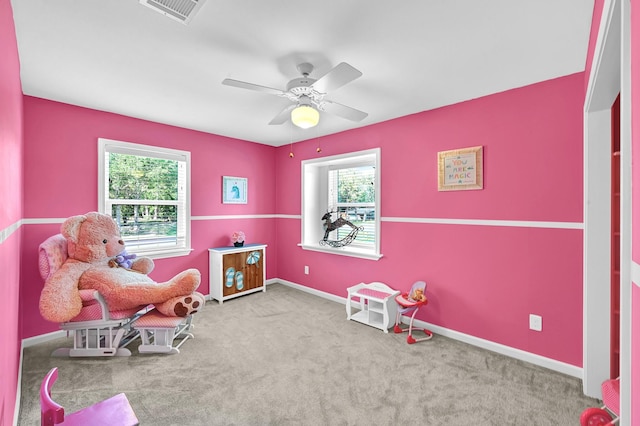 rec room with light colored carpet and ceiling fan