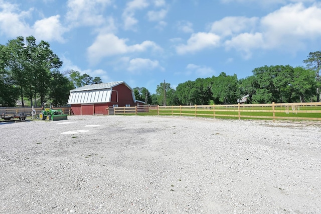 exterior space featuring a rural view and an outdoor structure