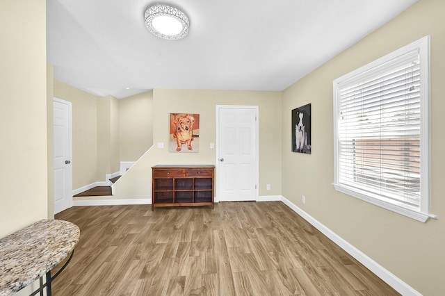 foyer entrance with hardwood / wood-style flooring