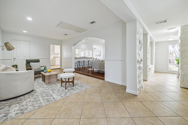 tiled living room with crown molding