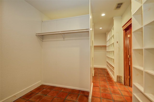 walk in closet featuring tile patterned flooring