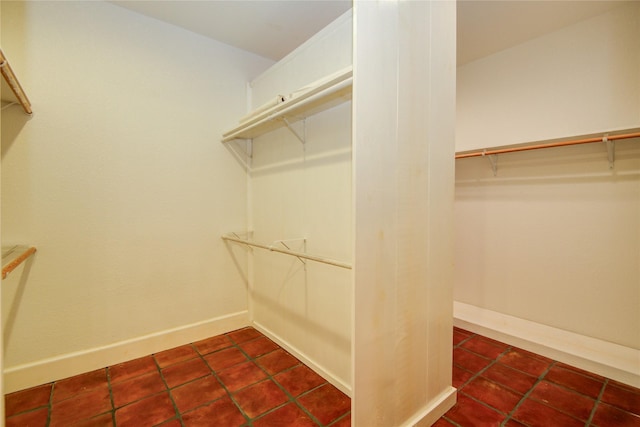 walk in closet with tile patterned flooring