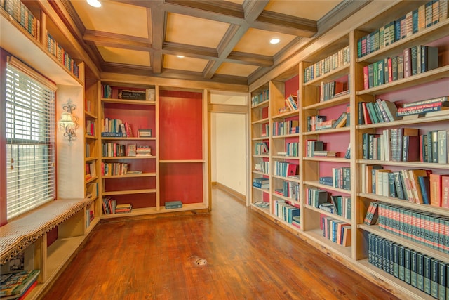 interior space featuring ornamental molding, wood-type flooring, coffered ceiling, and beam ceiling