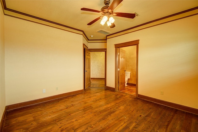 unfurnished room with ornamental molding, dark hardwood / wood-style floors, and ceiling fan