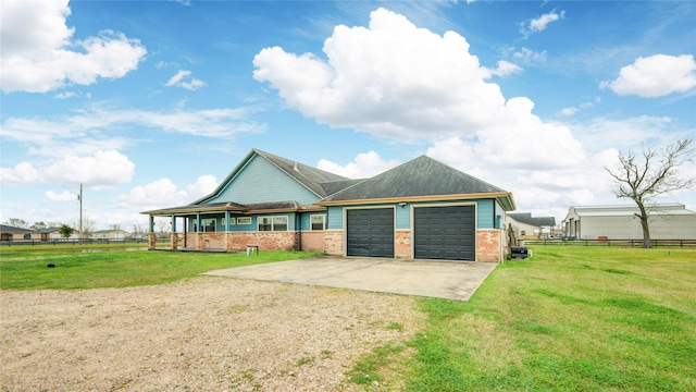 view of front of home with a garage and a front yard