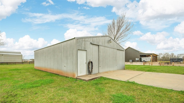 view of outdoor structure featuring a yard