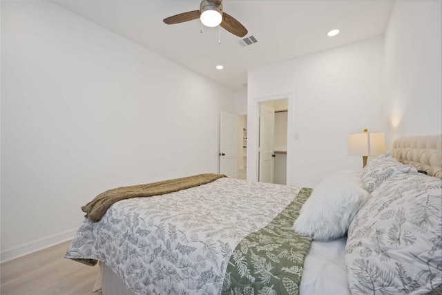 bedroom featuring ceiling fan and light wood-type flooring