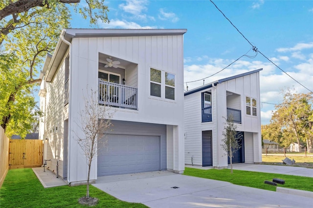 view of front of home featuring ceiling fan, a garage, a front lawn, and a balcony