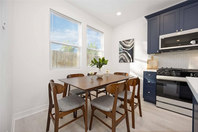 dining space featuring light hardwood / wood-style flooring