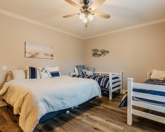 bedroom with wood-type flooring, ceiling fan, and crown molding