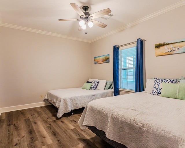 bedroom with crown molding, ceiling fan, and dark hardwood / wood-style flooring