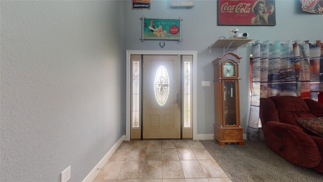 tiled entrance foyer featuring a healthy amount of sunlight