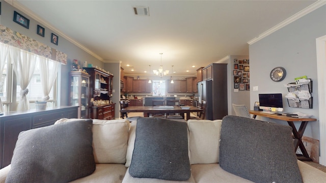 dining area featuring crown molding and a chandelier