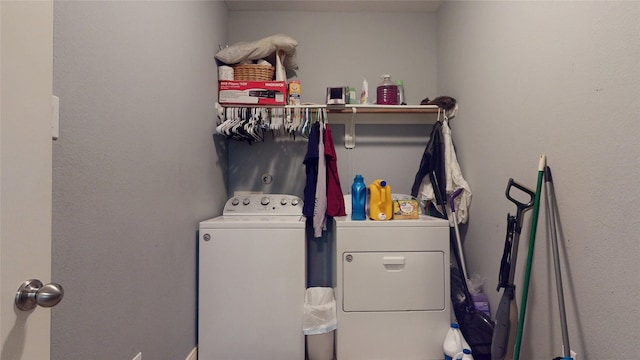 clothes washing area featuring washer and clothes dryer