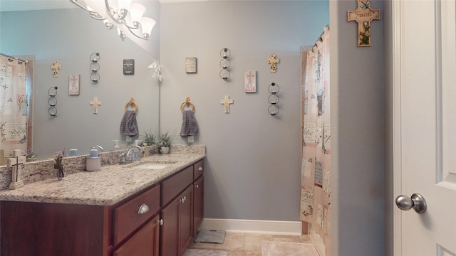 bathroom featuring vanity and a notable chandelier