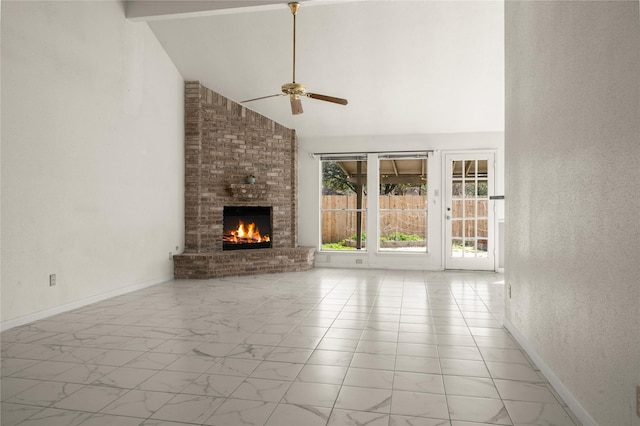 unfurnished living room featuring a brick fireplace, high vaulted ceiling, and ceiling fan