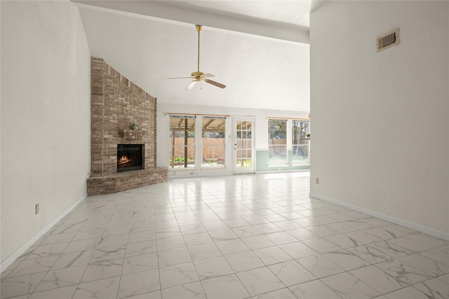 unfurnished living room with beamed ceiling, ceiling fan, high vaulted ceiling, and a brick fireplace