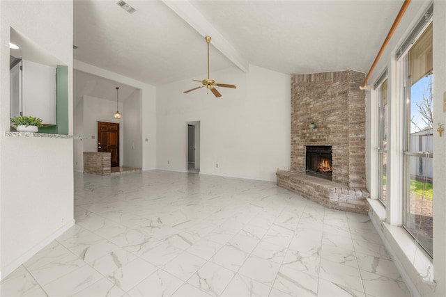 unfurnished living room with beam ceiling, a fireplace, high vaulted ceiling, and ceiling fan