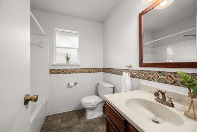 full bathroom featuring vanity, toilet, and tiled shower / bath combo