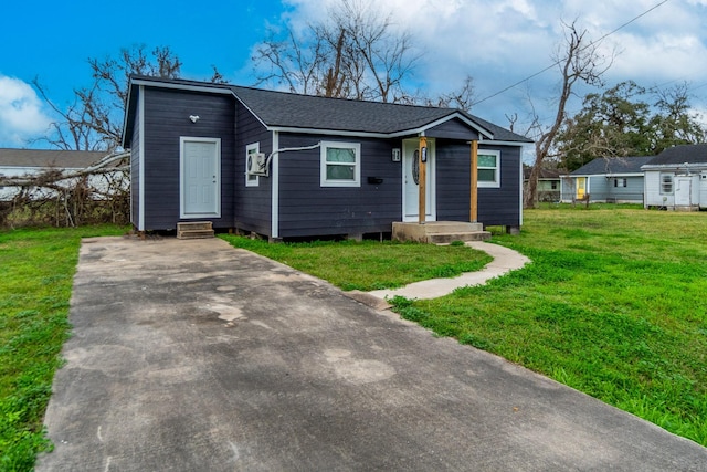 bungalow-style house featuring a front yard