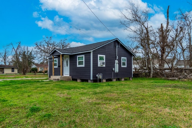 view of home's exterior featuring a yard and cooling unit