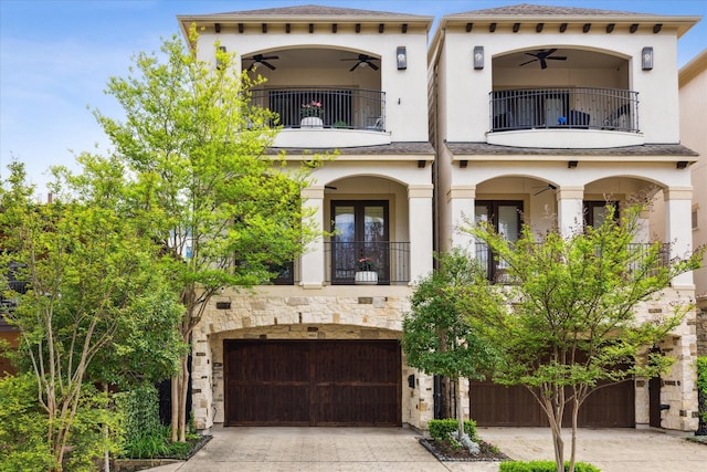 mediterranean / spanish-style house featuring a garage, a balcony, and ceiling fan