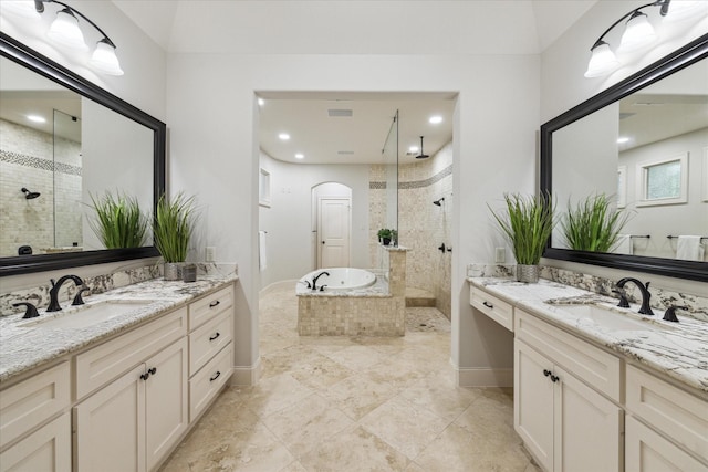 bathroom with vanity and separate shower and tub