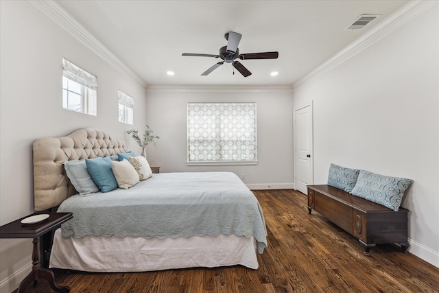 bedroom featuring crown molding, dark hardwood / wood-style floors, and ceiling fan