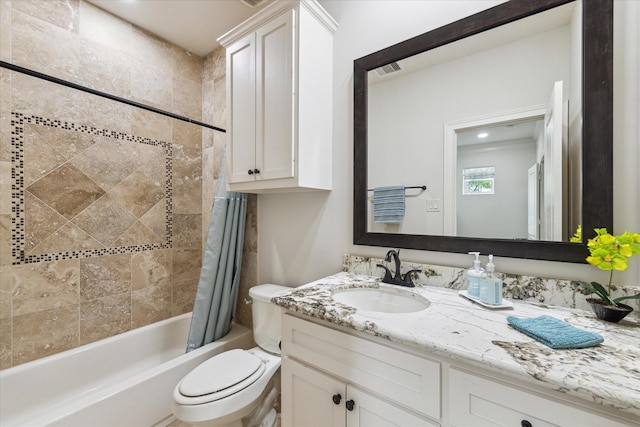 full bathroom with vanity, toilet, and shower / tub combo