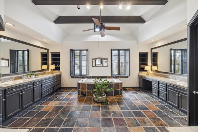 bathroom with lofted ceiling, vanity, a bathtub, and ceiling fan